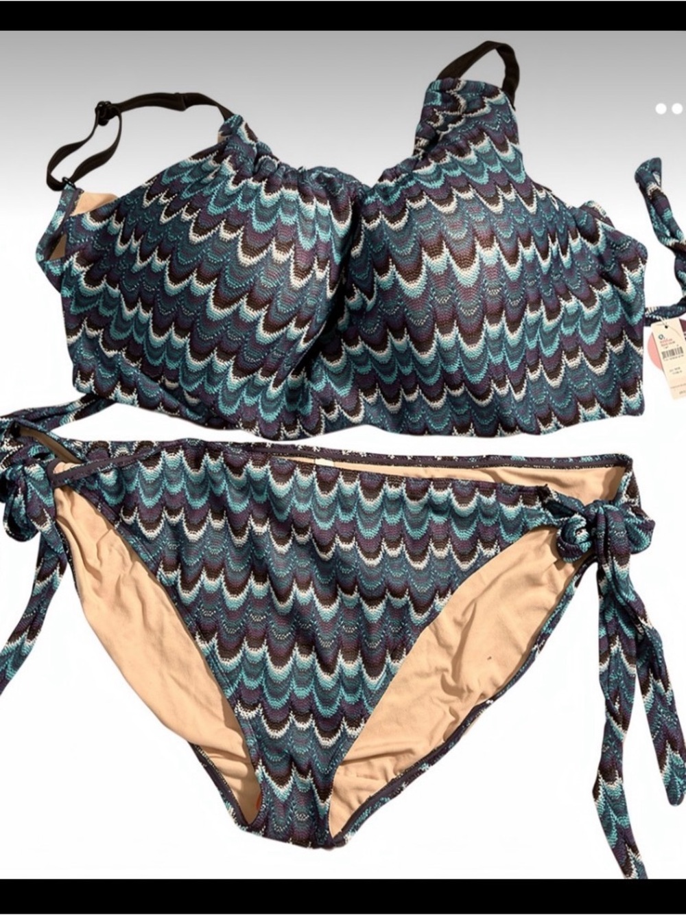 Cacique bikini set in a multicolor design, with a size 28 bottom and a 44F top.